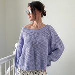 Woman wearing  SoftSpun textured boatneck sweater in lavender, front view with relaxed fit and airy knit