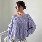 Woman wearing  SoftSpun textured boatneck sweater in lavender, front view with relaxed fit and airy knit