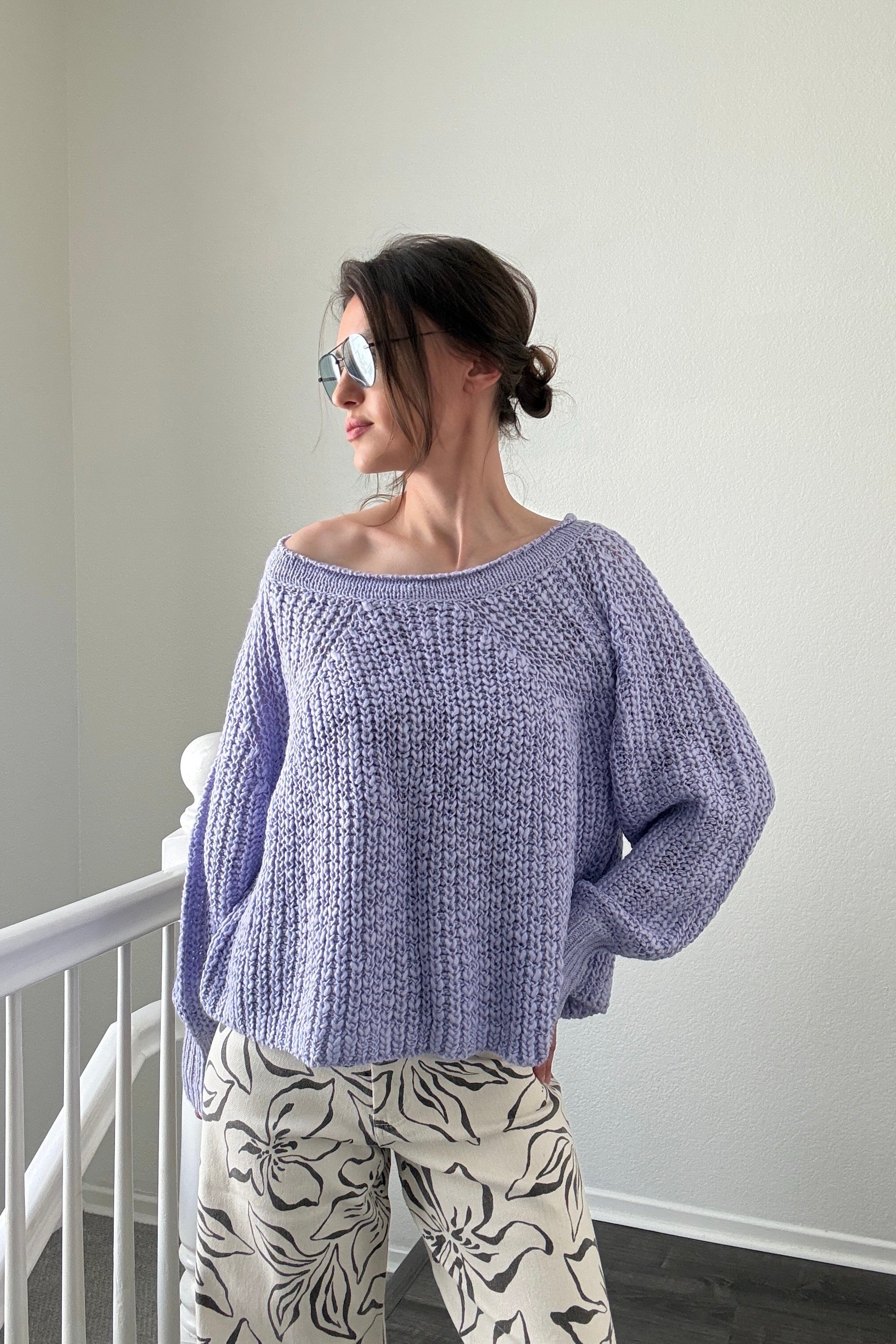 Woman wearing  SoftSpun textured boatneck sweater in lavender, front view with relaxed fit and airy knit