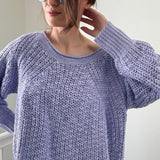 Close-up of airy textured knit on soft lavender boatneck sweater