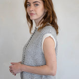 Woman wearing a sleeveless striped Hailey Piper Vest Cardigan  against a plain background