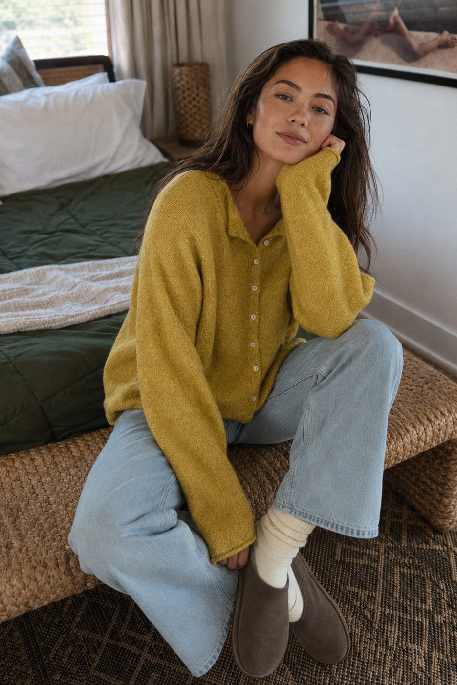 Things Between Piper Cardigan in Dijon Yellow styled with light-wash jeans for a casual indoor outfit
