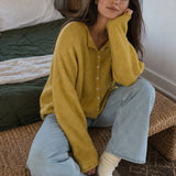 Things Between Piper Cardigan in Dijon Yellow styled with light-wash jeans for a casual indoor outfit
