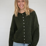 Things Between Piper Cardigan in hunter green, front view