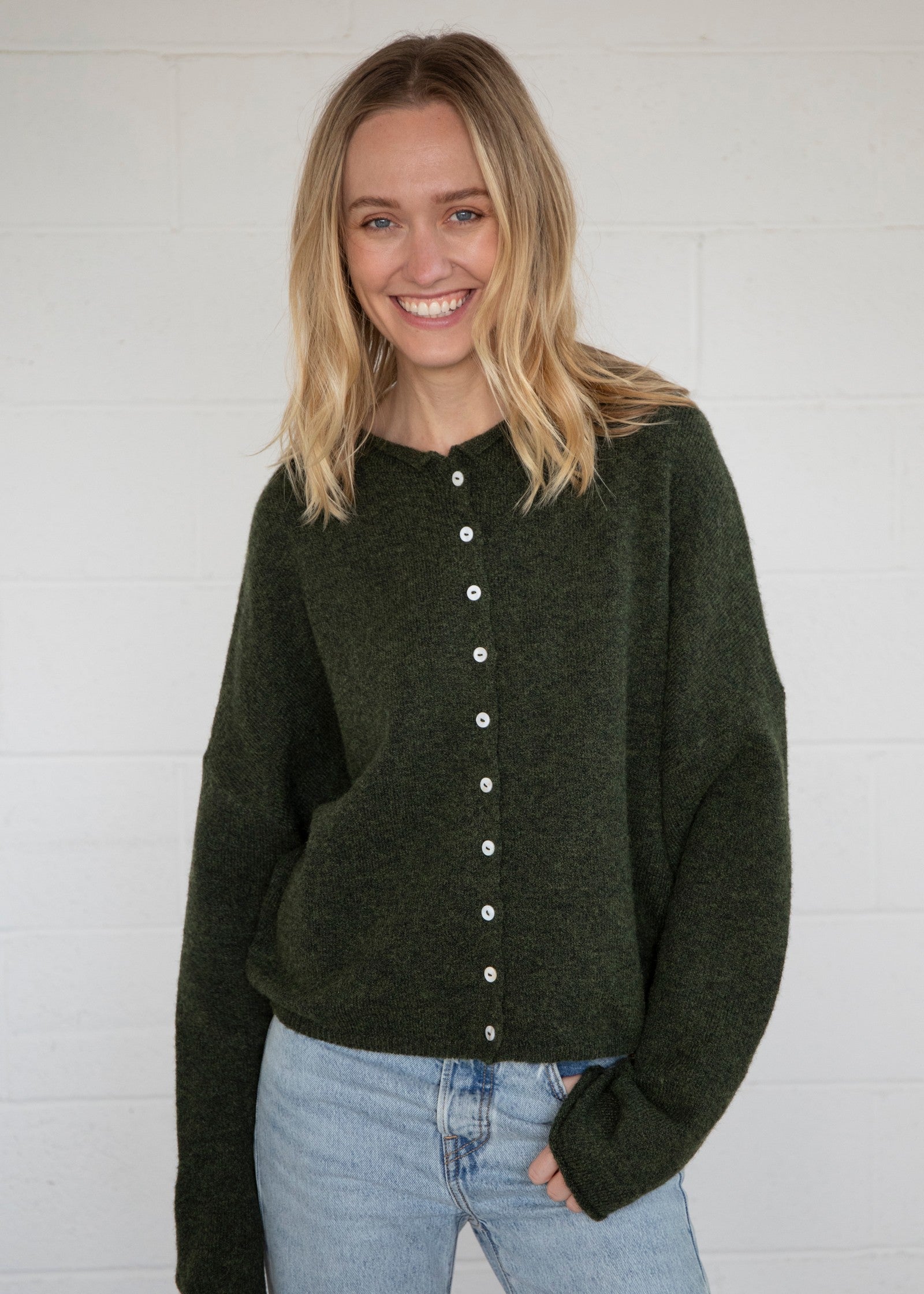 Things Between Piper Cardigan in hunter green, front view