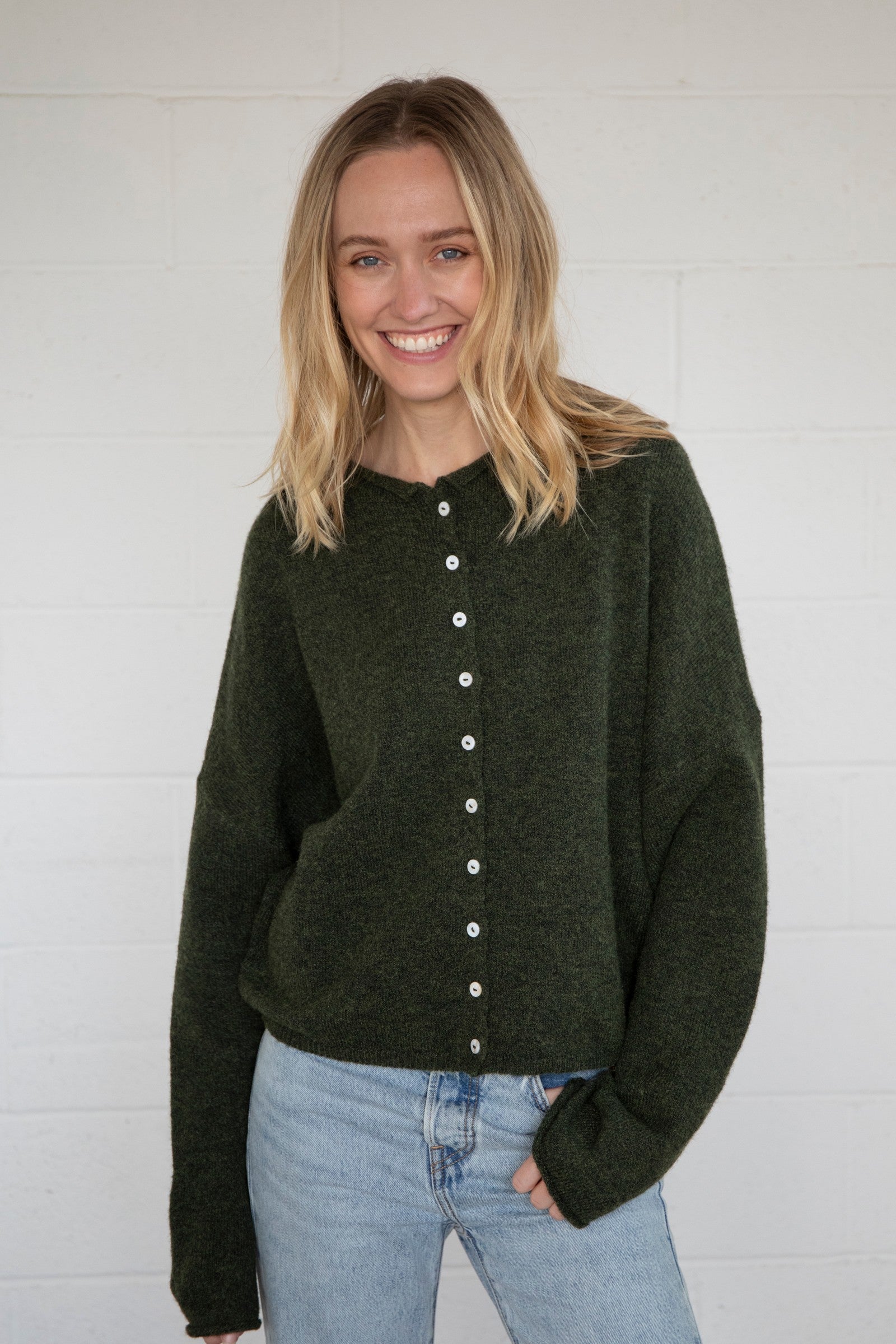 Things Between Piper Cardigan in hunter green, front view