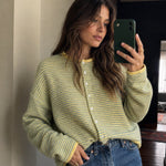 Woman wearing the Things Between Piper Cardigan in Pin-Striped Butter, front lifestyle view styled for an easy everyday outfit