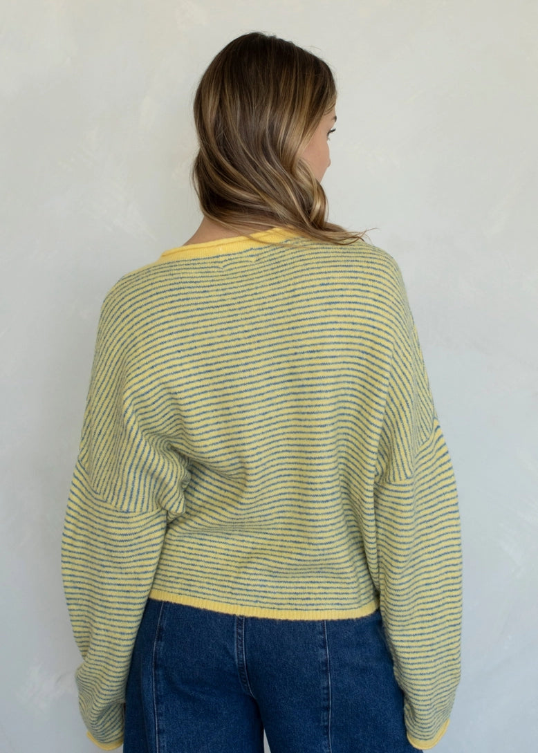 Things Between Piper Cardigan in Pin-Striped Butter, back studio view showing the relaxed fit and lightweight knit