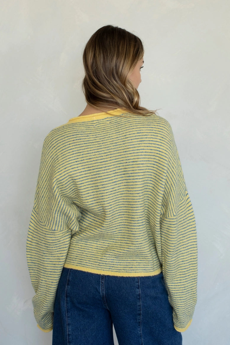 Things Between Piper Cardigan in Pin-Striped Butter, back studio view showing the relaxed fit and lightweight knit