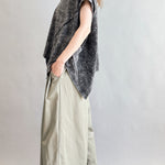 Angled side view of Trinity oversized short sleeve top in charcoal