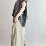 Angled side view of Trinity oversized short sleeve top in charcoal