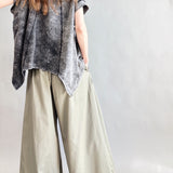Back view of Trinity flowy oversized top with curved hem in charcoal