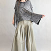Trinity flowy oversized top in charcoal with relaxed fit and curved hem