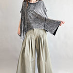 Trinity flowy oversized top in charcoal with relaxed fit and curved hem