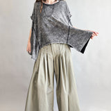 Trinity flowy oversized top in charcoal with relaxed fit and curved hem