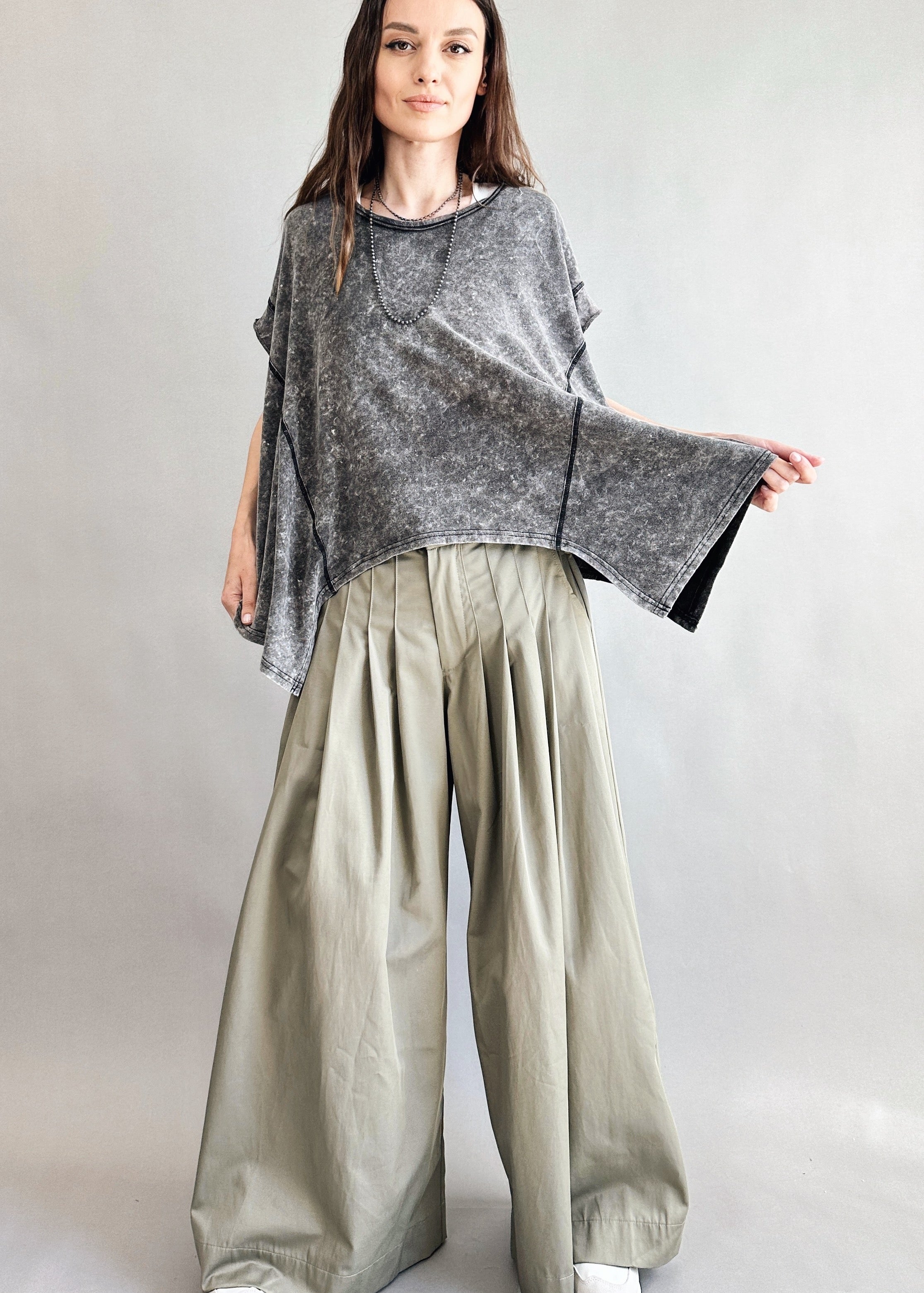 Trinity flowy oversized top in charcoal with relaxed fit and curved hem