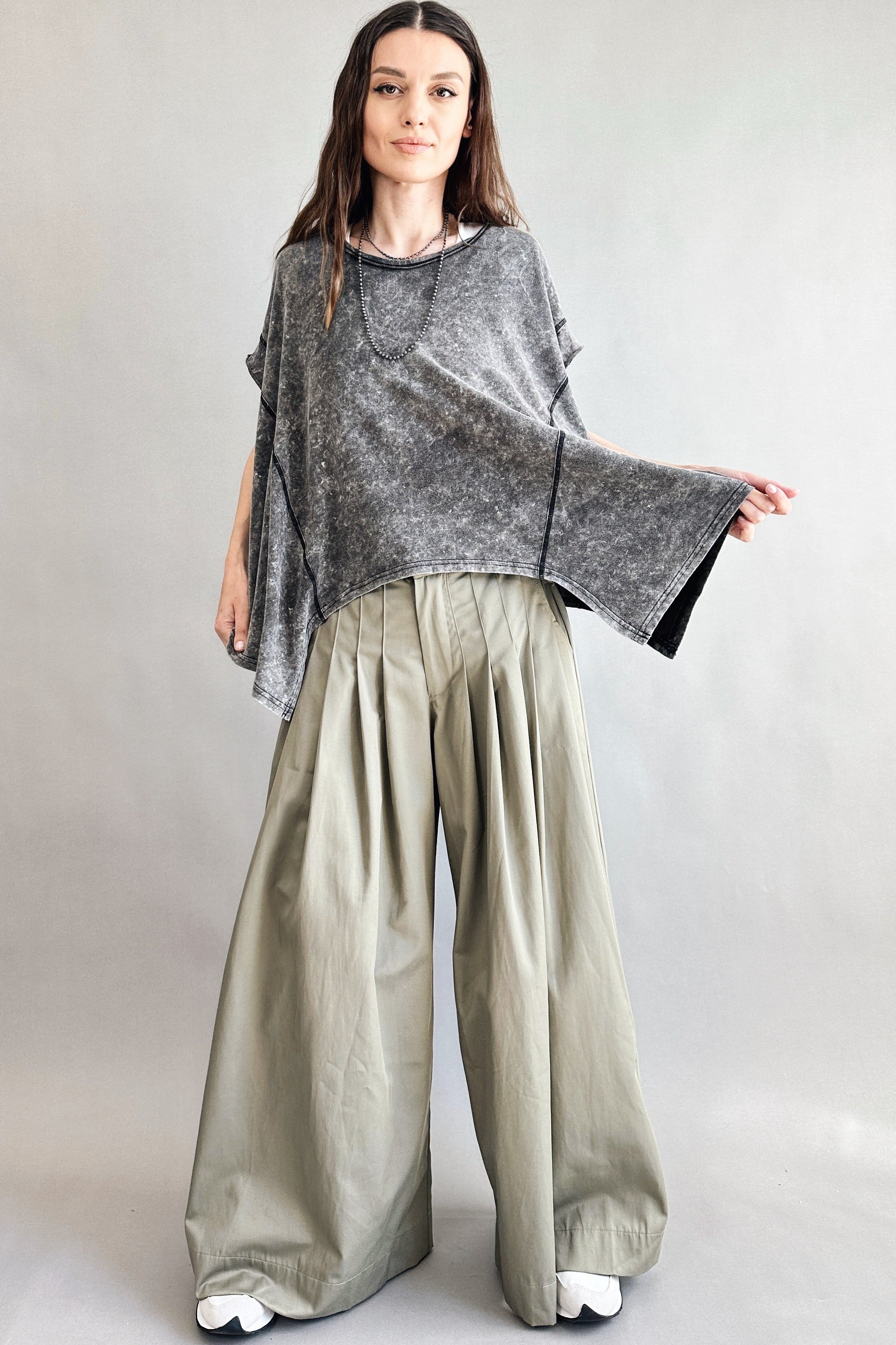 Trinity flowy oversized top in charcoal with relaxed fit and curved hem