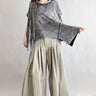 Trinity flowy oversized top in charcoal with relaxed fit and curved hem