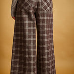 Back view of Trudy chocolate plaid pants with elastic waistband and pockets