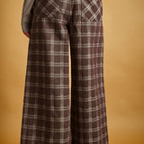 Back view of Trudy chocolate plaid pants with elastic waistband and pockets