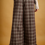 Front view of Trudy chocolate plaid wide-leg pants with ruffle hems