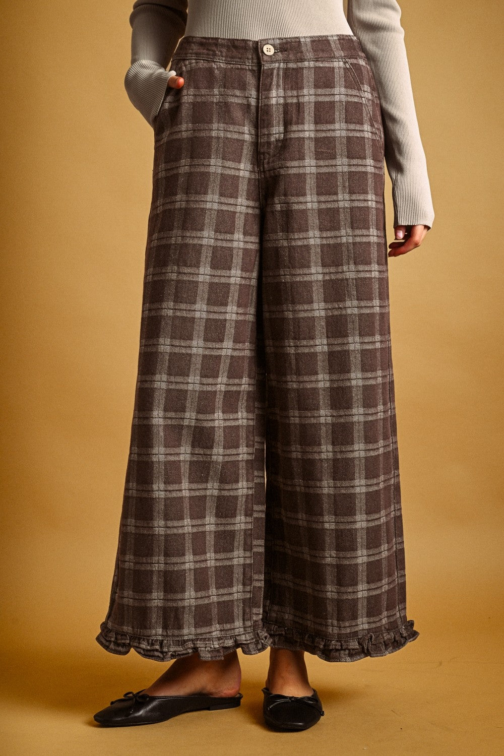 Front view of Trudy chocolate plaid wide-leg pants with ruffle hems