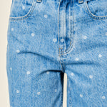 Close-up of Truro High Rise Barrel Jeans in Denim Polka Dot showing the denim fabric and polka dot print