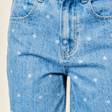 Close-up of Truro High Rise Barrel Jeans in Denim Polka Dot showing the denim fabric and polka dot print