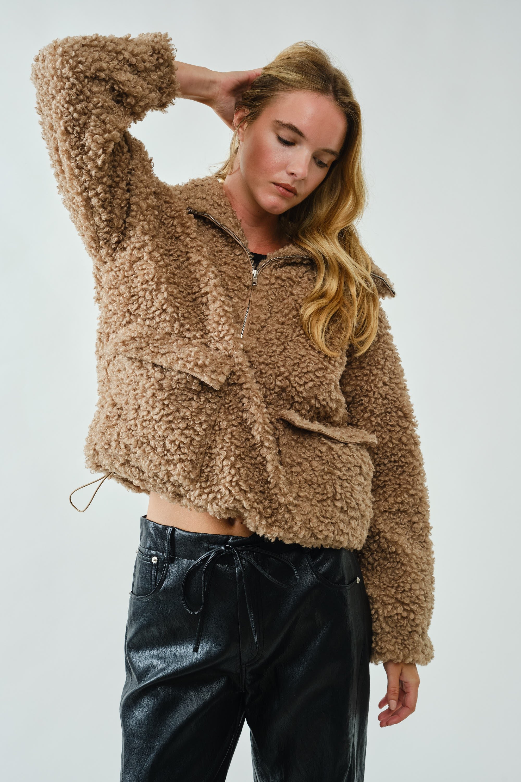 Angled view of ultra soft half zip teddy jacket with plush teddy fabric