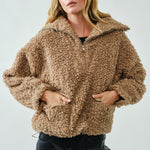 Front view of ultra soft half zip teddy jacket showing patch pockets in taupe