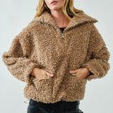 Front view of ultra soft half zip teddy jacket showing patch pockets in taupe