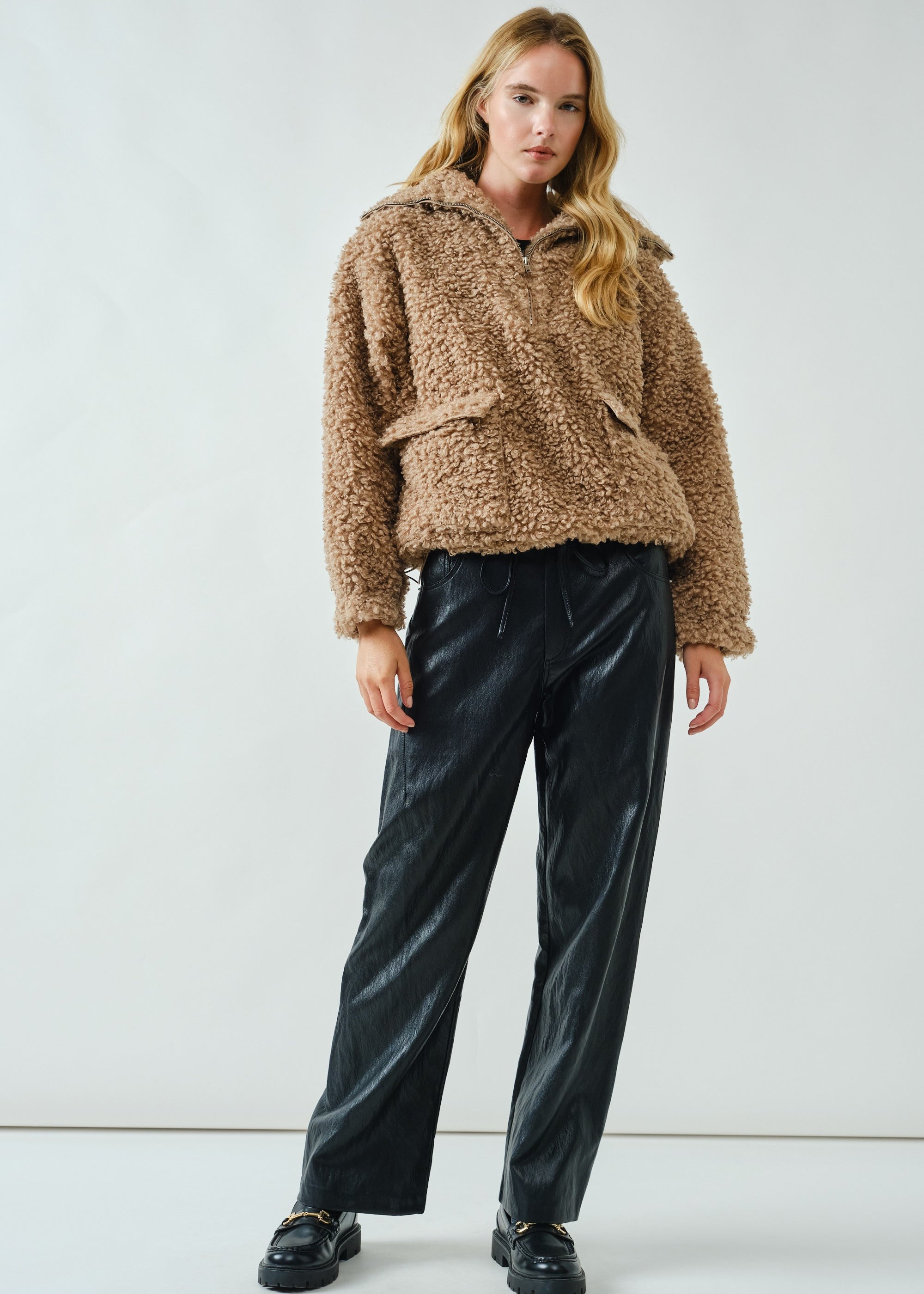 Full body view of ultra soft half zip teddy jacket styled casually in taupe