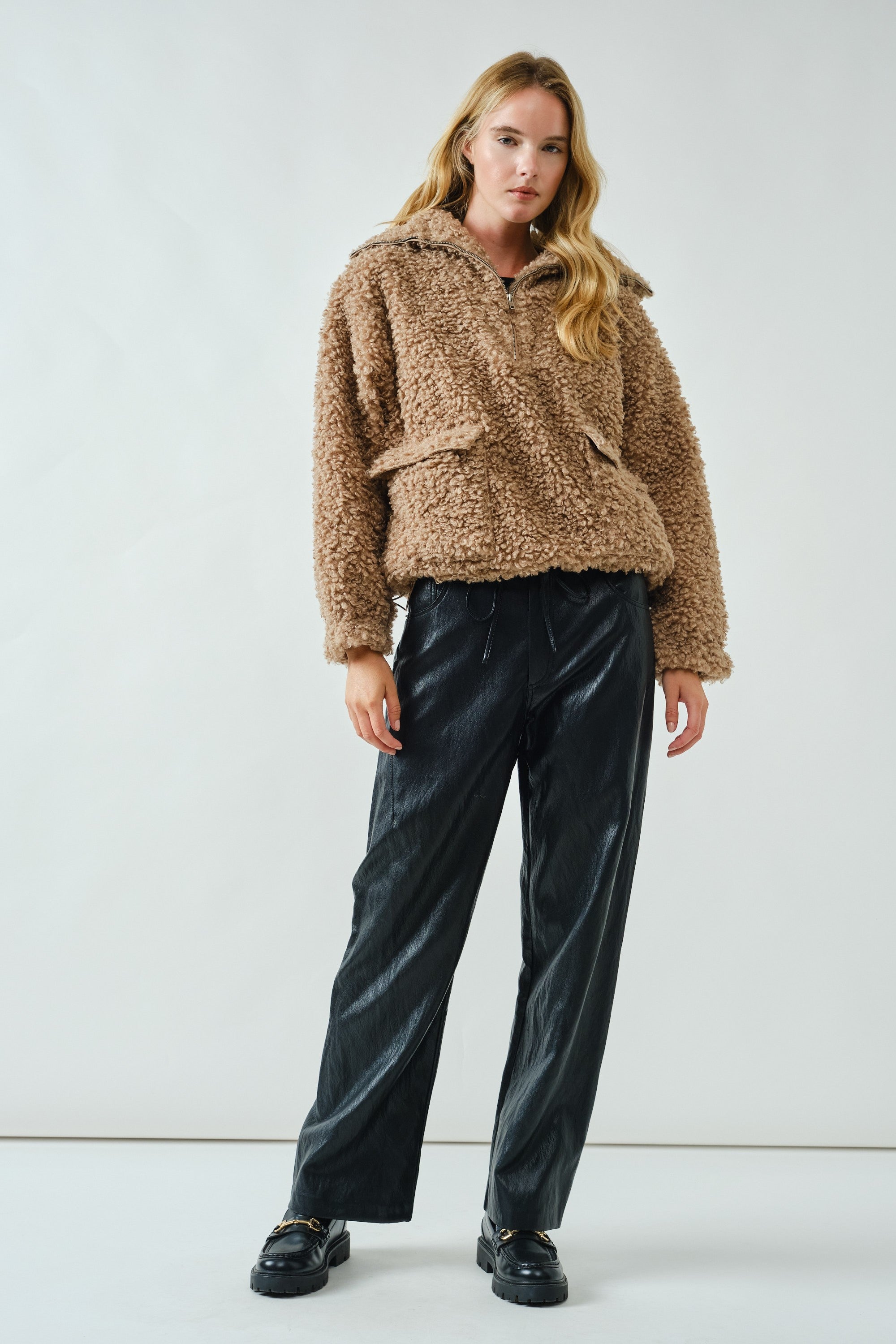 Full body view of ultra soft half zip teddy jacket styled casually in taupe