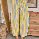 Front view of Venus Stripe Barrel Jeans in Yellow with blue and white vertical stripes, high-rise waist, and relaxed barrel-leg fit.