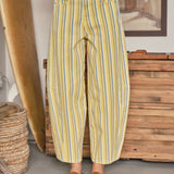 Front view of Venus Stripe Barrel Jeans in Yellow with blue and white vertical stripes, high-rise waist, and relaxed barrel-leg fit.