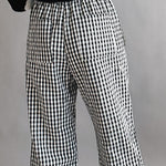 Close-up back view of black gingham cotton fabric on Wanderlust boxer pants