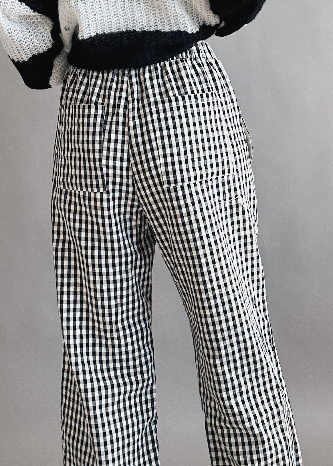 Close-up back view of black gingham cotton fabric on Wanderlust boxer pants