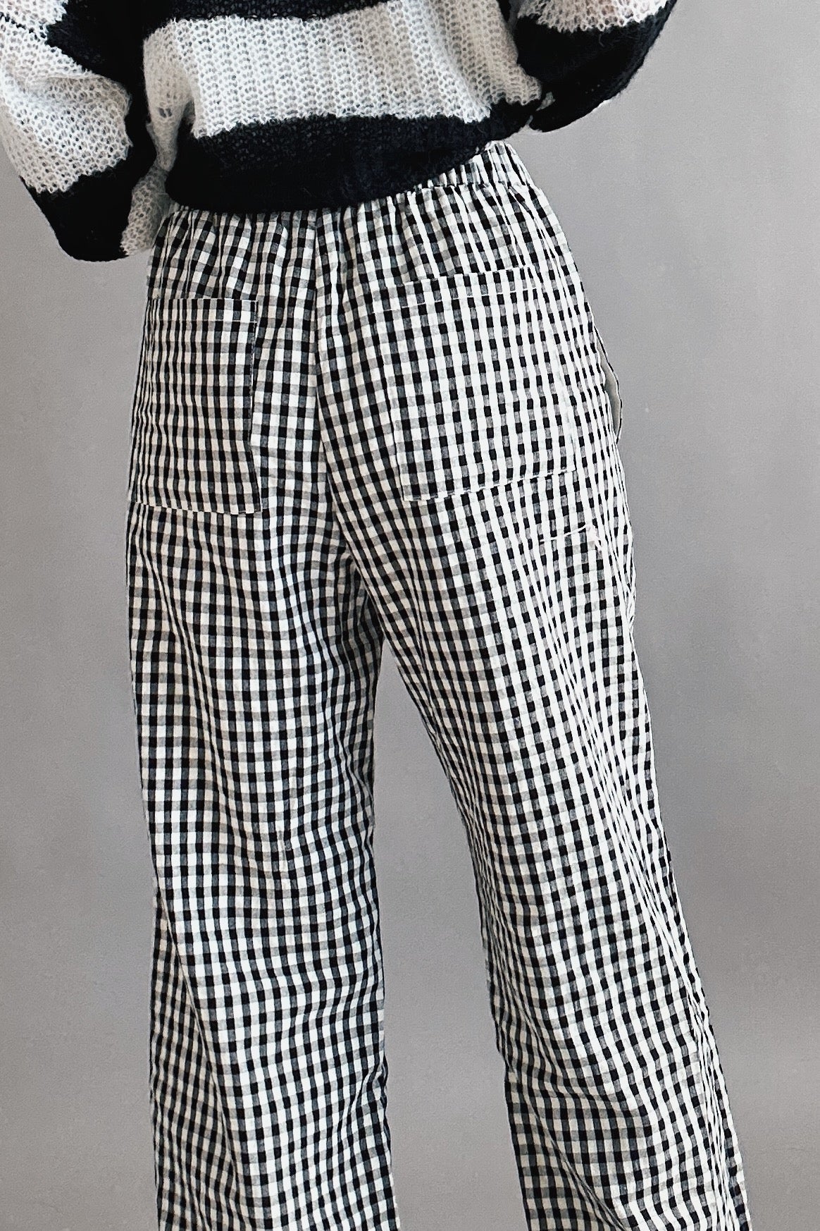 Close-up back view of black gingham cotton fabric on Wanderlust boxer pants