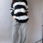 Front view of Wanderlust black gingham boxer pants styled casually