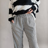 Close-up of front view of black gingham cotton fabric on Wanderlust boxer pants