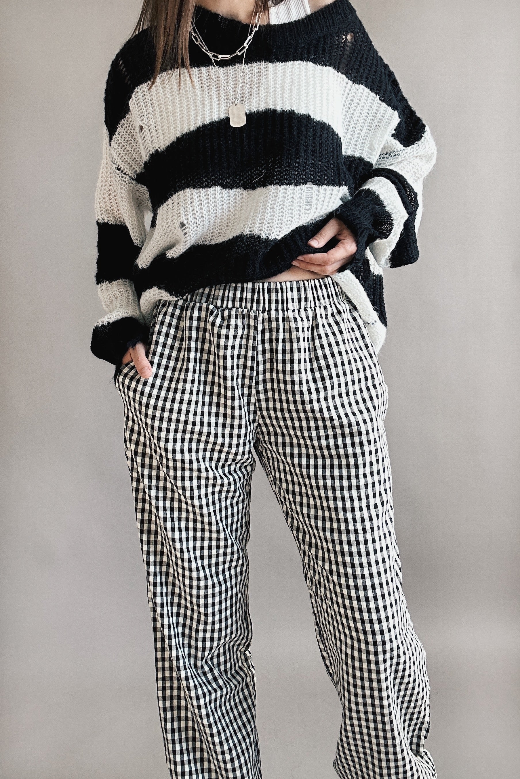 Close-up of front view of black gingham cotton fabric on Wanderlust boxer pants