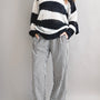 Model is wearing Wanderlust gingham boxer pants in black with elastic waistband and relaxed fit