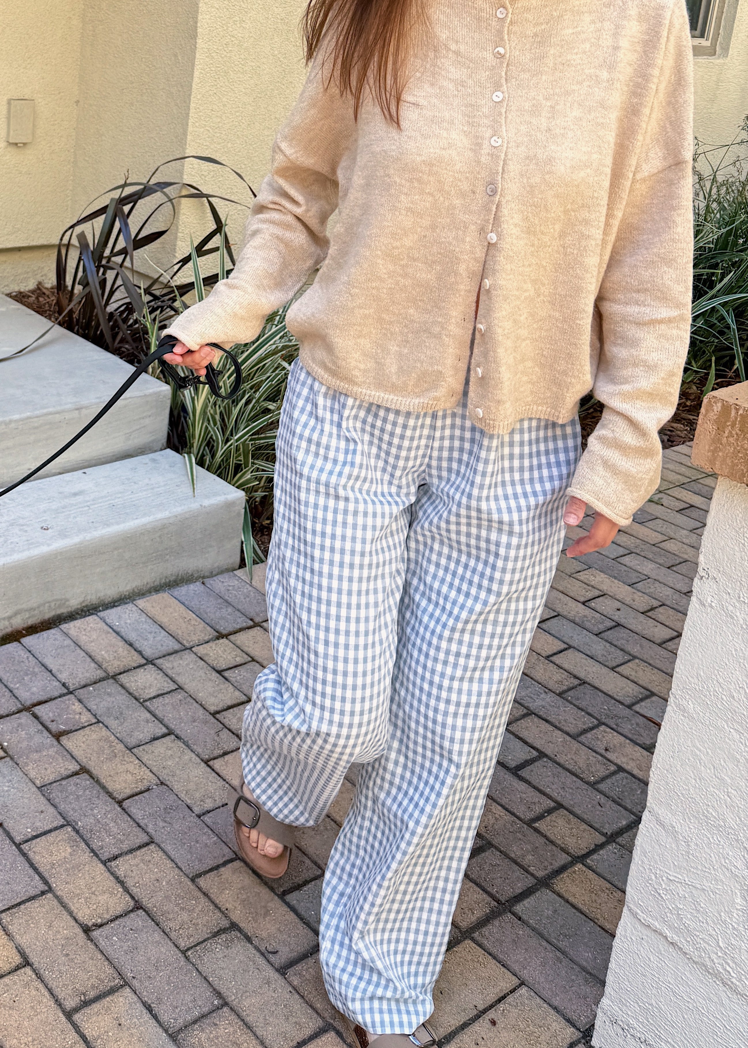 Front view of Wanderlust blue gingham boxer pants styled casually outdoors