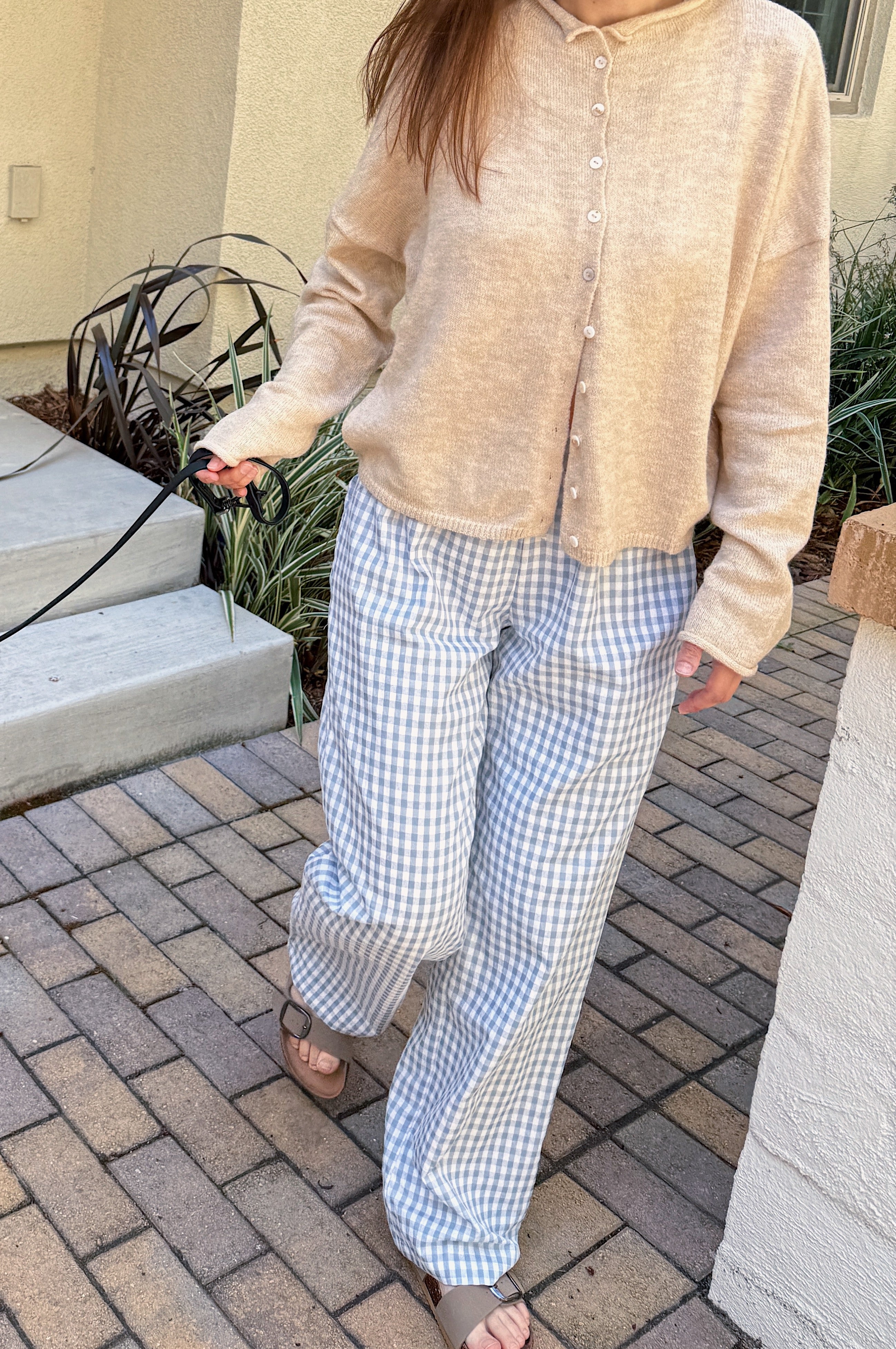 Front view of Wanderlust blue gingham boxer pants styled casually outdoors