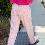Wanderlust gingham boxer pants in pink with elastic waistband and relaxed fit - side view - walking pose