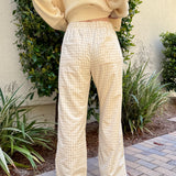 Back view of Wanderlust gingham boxer pants in yellow (oatmeal) with pocket detail