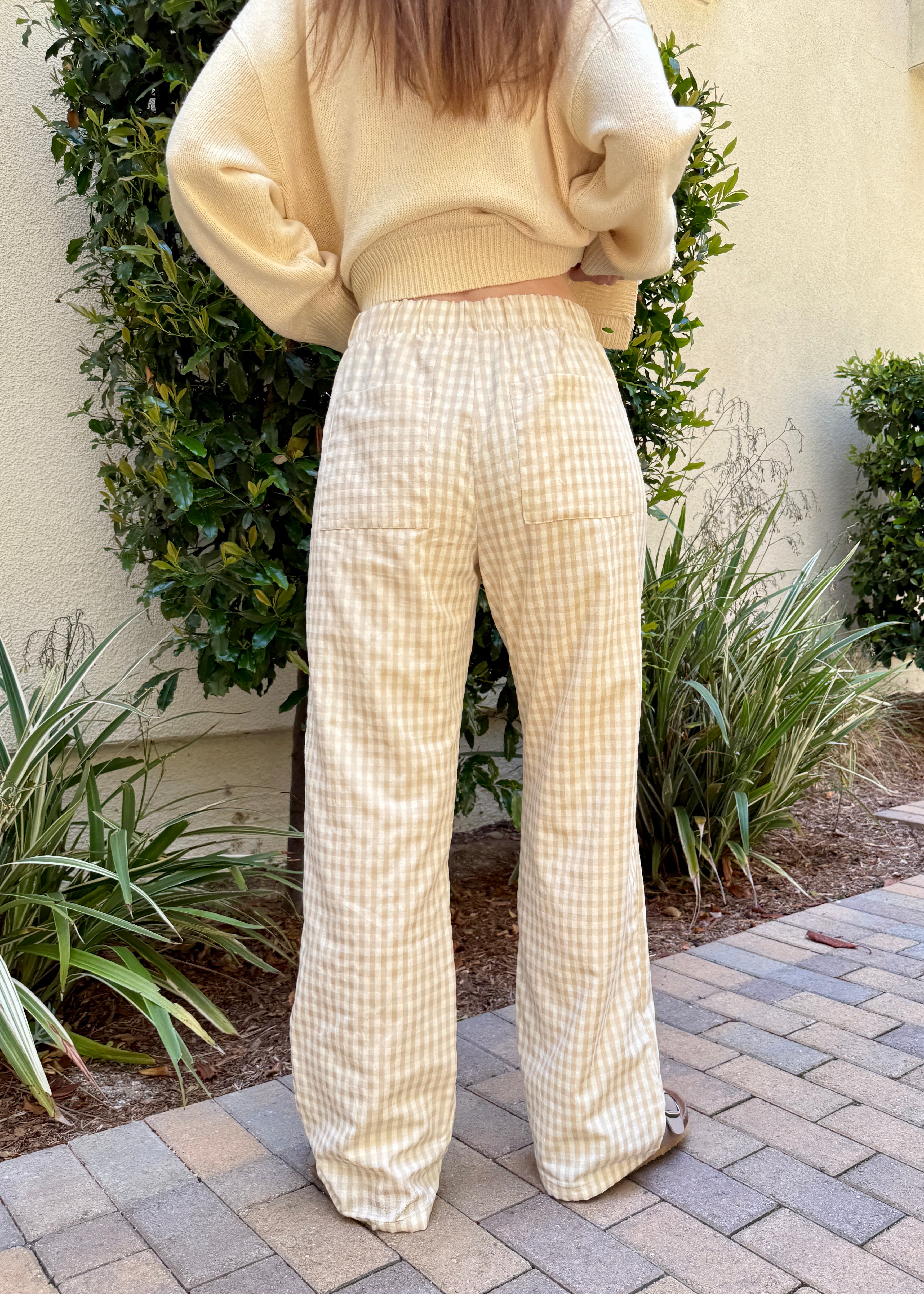 Back view of Wanderlust gingham boxer pants in yellow (oatmeal) with pocket detail