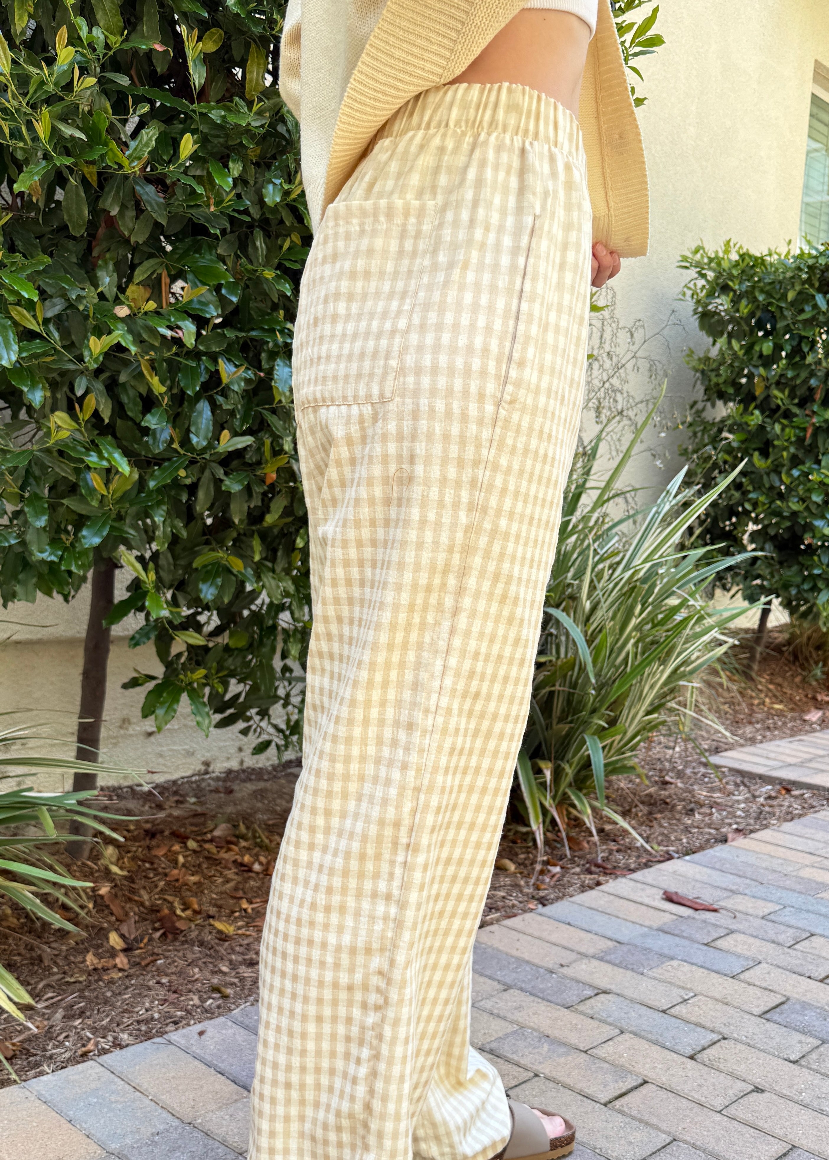 Side view of Wanderlust yellow (oatmeal) gingham boxer pants showing relaxed silhouette