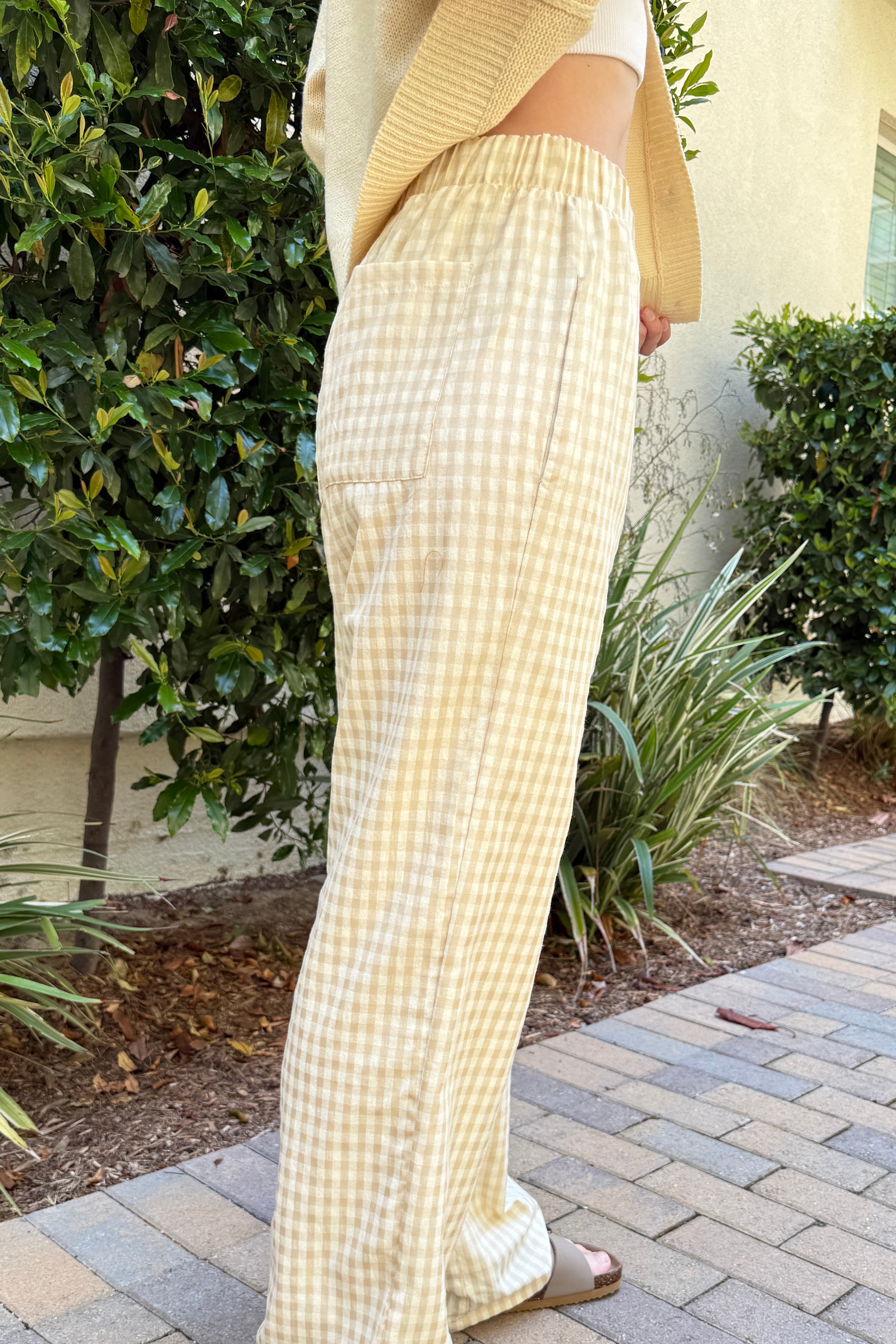 Side view of Wanderlust yellow (oatmeal) gingham boxer pants showing relaxed silhouette