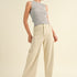 Model is wearing Wild Honey straight wide leg denim pants in beige with high-rise fit